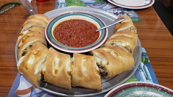 Freshly prepared Italian dish at Tomatoes Pizzeria